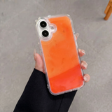 Coque NØIR orange — halo phosphorescent dans le noir