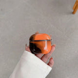 Coque AirPods LUCIØLE Orange — de jour, translucide